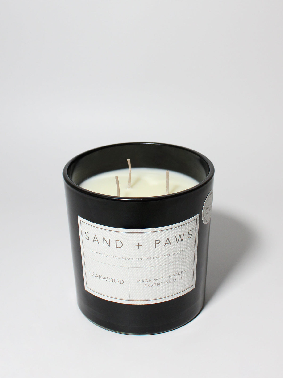 Cozy Sand + Paws Teakwood 21 oz scented candle